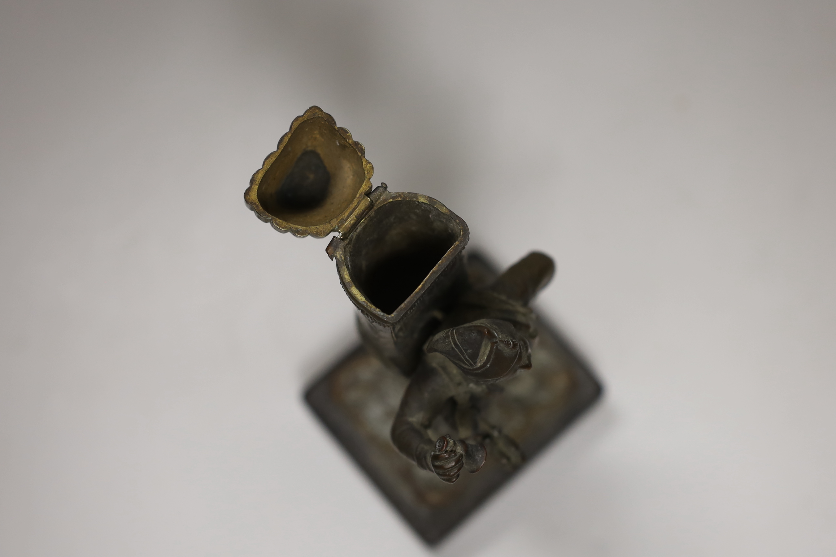 An early 20th century bronze figural match holder, on slate plinth, 20cm